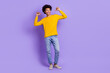 Full size photo of optimistic cool guy dressed yellow long sleeve denim pants directing at himself isolated on purple color background