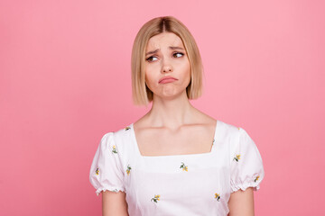 Portrait photo of young funny depressed girl crying negative mood sad quarrel conflict look empty space isolated on pink color background