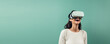 © dinastya - Joyful young woman smiling in white virtual reality glasses isolated on flat pastel green background with copy space. Happy girl in the VR glasses. Generative AI  studio photo.