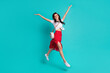 © deagreez - Photo of charming shiny lady dressed white crop top jumping high having fun isolated turquoise color background