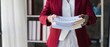 © Natee Meepian - business people holding documents big stack of papers documents on office