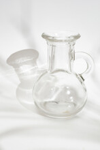Empty Round Shaped Little Glass Vase On White Background