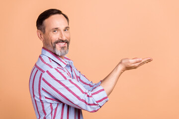 Poster - Side profile photo of positive nice person with white gray beard palms presenting offer empty space isolated on pastel color background