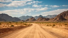 Arabian Adventure: Exploring The Beautiful And Barren Hajar Mountains On A Dirt Road In Dubai, UAE With Blue Skies And Bright Clouds: Generative AI