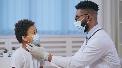 Wall Mural - Child ENT doctor examining little patient in hospital, regular health checkup