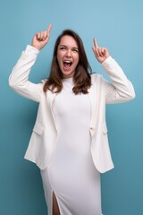 Wall Mural - smiling young brunette with long hair lady in white dress has a cool idea and wants to tell about it