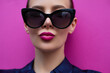 Sunglasses fashion model portrait.  Classic style glasses shape.  Pink lips blowing kiss. Beautiful woman in cat eyes black glasses again pink background 