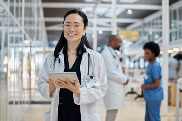 Canvas Print - Asian woman, portrait and happy doctor with tablet in hospital for healthcare, telehealth and research. Medical professional, face and surgeon, worker or employee with glasses for wellness technology