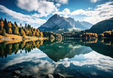 A Serene Mountain Landscape With A Reflective Lake, Surrounded By Picturesque Mountains And Trees, Illustrating Nature's Serene Beauty. High Quality Photo