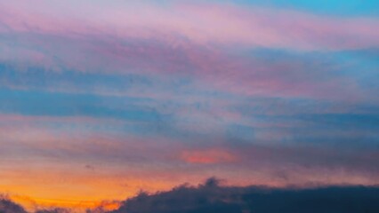 Poster - Natural Transition To Morning Colorful Dawn. Sunrise Sky Background Backdrop. Bright Dramatic Sky With Colourful Clouds. Sky In Blue Yellow Orange Pink Colors. 4K.
