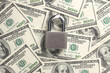 © splitov27 - Protect your finances. Metal lock on hundred dollar bills