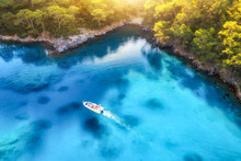 Speed Boat On Blue Sea At Sunrise In Summer. Aerial View Of Motorboat In Blue Lagoon, Rocks In Clear Azure Water. Tropical Landscape With Yacht,  Mountain With Green Forest. Top View. Oludeniz, Turkey