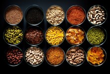 Top View Of A Lot Of Glass Jars Filled With All Kinds Of Spices Of Different Types Of Beans