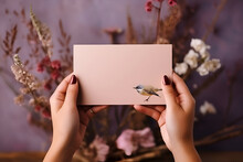 A Woman With A Manicure Holds An Envelope With A Painted Bird On The Background Of A Bouquet Of Flowers, 
