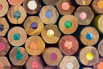 flat ends of a bunch of multi coloured wooden pencils with colored leads