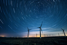 A Massive, Moonlit Wind Farm, Modern Wind Turbines Spinning Against The Night Sky, Star Trails In The Background