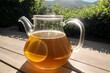 A pot of sun tea brewing in the afternoon heat