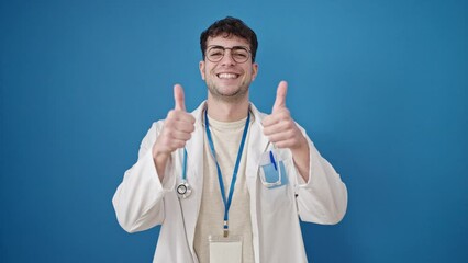 Poster - Young hispanic man doctor doing thumbs up over isolated blue background