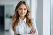 © Srikanth - Young white woman, professional entrepreneur standing in office