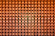 Flower fretwork red brick pattern wall, perforated framework background, texture on red brick wall