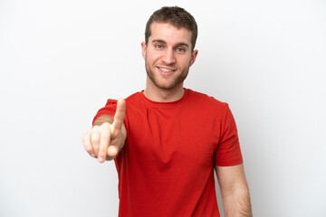 Wall Mural - Young caucasian man isolated on white background showing and lifting a finger