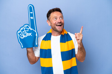 Wall Mural - Middle age caucasian sports fan man isolated on blue background pointing up a great idea