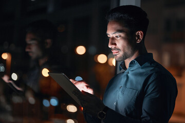 Poster - Night, work or man reading on tablet for research, project or planning a proposal in office building, startup or professional employee. Overtime, working or search on internet or online communication