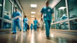 Busy hospital corridor blurred doctors. Motion Blur Shot Of Medical Staff Wearing Scrubs In Busy Hospital Corridor