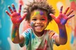 Cute toddler has colorful painty hands in school, Back to school concept