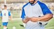 © Daniels C/peopleimages.com - Soccer field, phone and man hands for competition, training or fitness news, social media chat and blog. Football player or person typing on mobile app for sports information, health or goals check