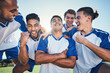 © Daniels C/peopleimages.com - Win, football player and men celebrate together on a field for sports and fitness achievement. Happy male soccer team or athlete group with fist for challenge, competition or pride outdoor on pitch