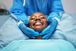 Smile, beauty and hands of surgeon on black woman face in clinic for plastic surgery, skincare or chemical peel. Medical, facial and female consulting dermatologist on anti aging, collagen or filler
