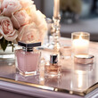 Bottles of perfume and flowers on table in room, pink tones, closeup photography for luxury beauty brand design. Generative AI