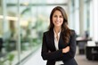 © Yuliia - Corporate portrait woman Caucasian confident businesswoman posing in office company indoors hands crossed smiling toothy successful top manager female girl employer business leader looking at camera