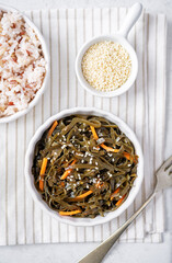 Wall Mural - Seaweed with carrot and sesame seeds in a bowl