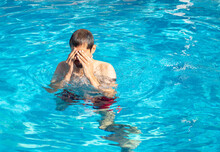 Man Covering Eyes With Hands And Itchy From Hotel Pool Chlorine
