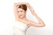 © kitthanes  - Beautiful Young Asian woman lifting hands up to show off clean and hygienic armpits or underarms on white background, Smooth armpit cleanliness and protection concept