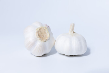 Fresh garlic herb food on a white background.This culinary ingredient adds natural flavor and aroma to your meals. Ideal for gourmet cooking and food styling. A tasty addition to any recipe.