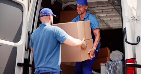Male Movers In Uniform Loading Delivery