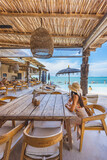 Fototapeta  - Traveler asian woman travel and relax in beach cafe at Koh Samui summer Thailand