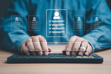 Headhunter using computer to check and select the optimum resume application form , Human development and recruitment to interview and join with company concept.