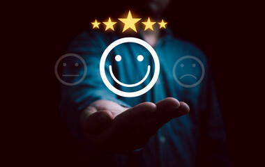 Businessman hand give smile face with glowing yellow five stars for client the best satisfaction evaluation survey after use product and service concept.