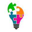 © dlyastokiv - Concept of creative teamwork with light bulb of colored puzzle – stock vector