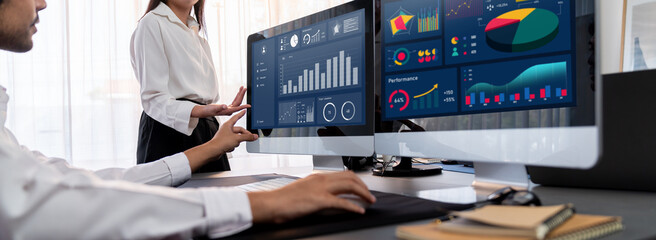 Poster - analyst working on data analysis or bi dashboard on computer monitor. business team analyzing financ