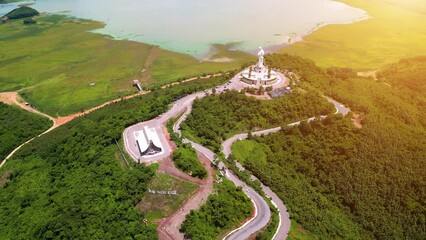 Wall Mural - Aerial view of Our lady of Lourdes Virgin Mary catholic religious statue on a Nui Cui mountain in Dong Nai province, Vietnam.