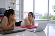 © Suney - Women play yoga at home. Healthy lifestyle and friendship concept
