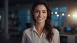 © DanteVeiil - Professional woman standing in her office while looking at camera and smiling