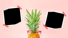 Pineapple With Pink Glasses And Blank Photo Frames On Bright Pink Background. Original Pineapple Decoration. Minimal Summer Concept. Summer Memories.