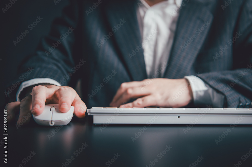 Someone Using A Keyboard Close up of businessman hand using mouse and typing on computer ...