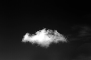Wall Mural - clouds over black background .